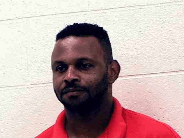Booking photo of Dennis Hudson
