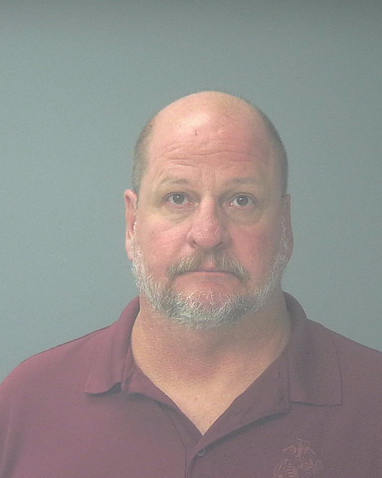 Booking photo of William Gibson