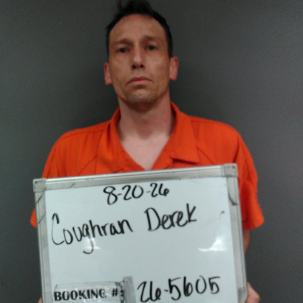 Booking photo of Derek Coughran