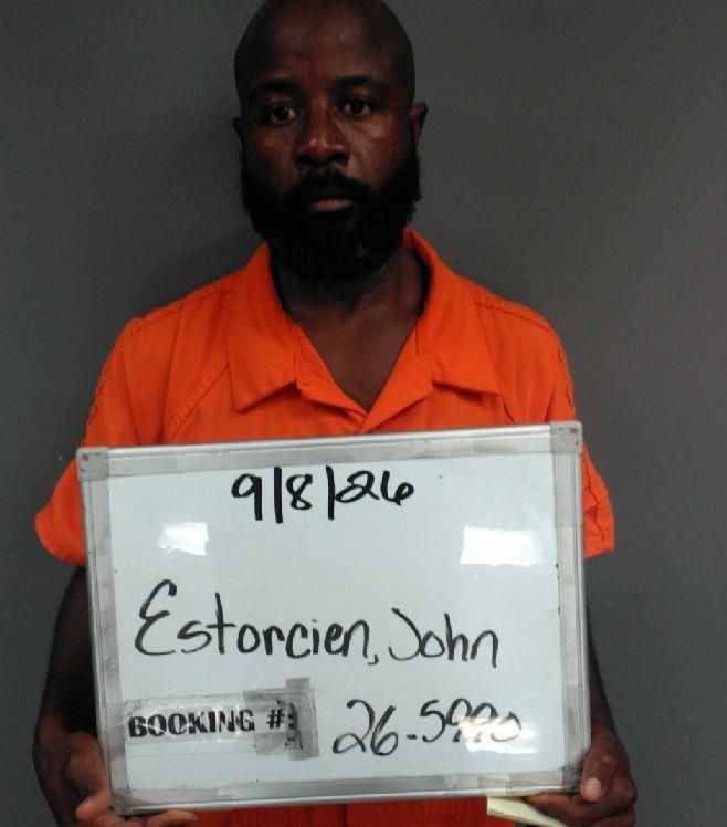 Booking photo of John Estorcien