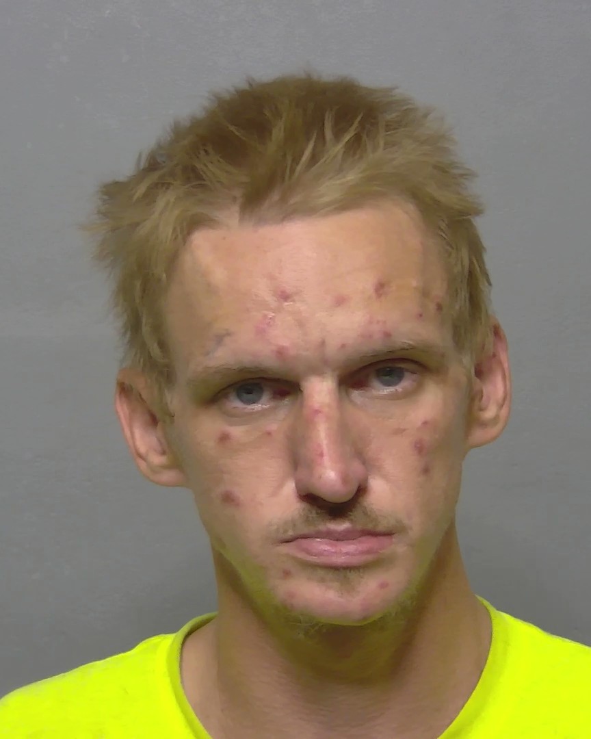 Booking photo of Erik Raymond