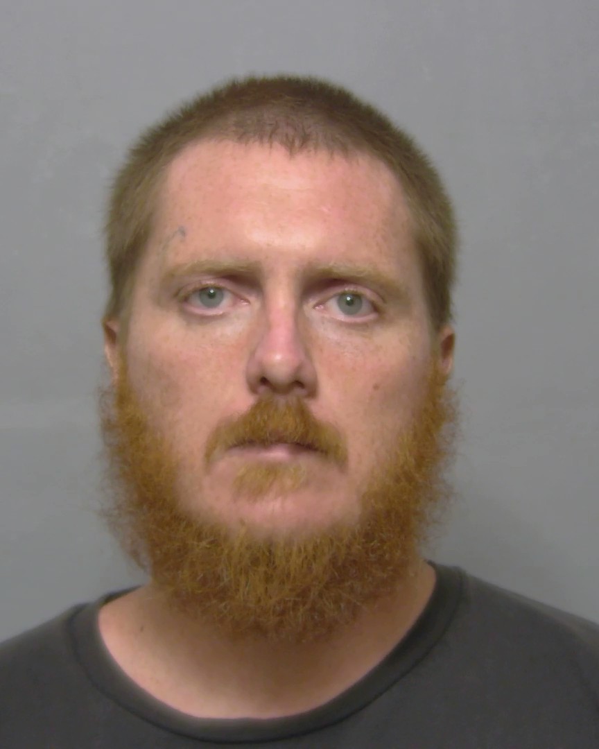 Booking photo of John Cooper
