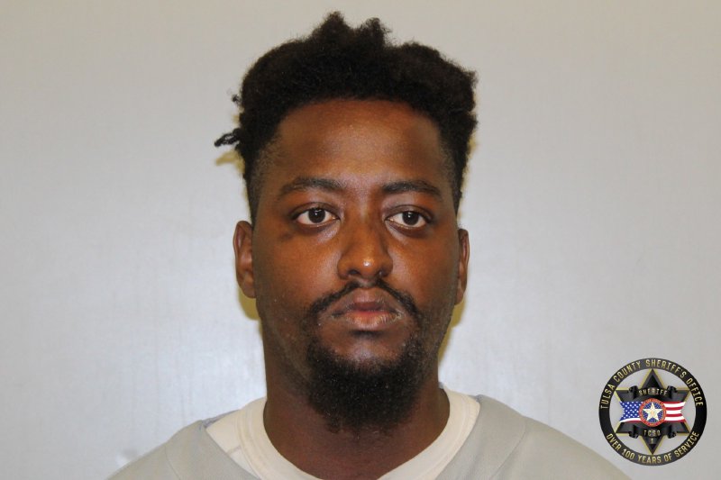Francis Ntimba booking photo