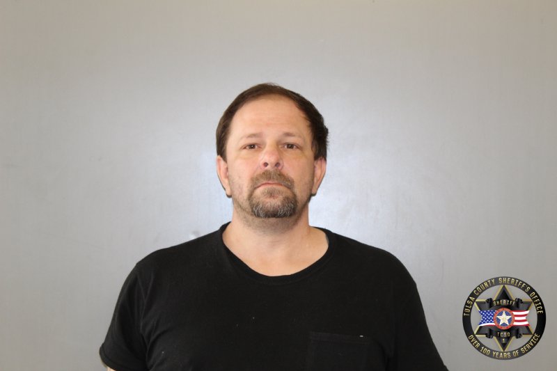 Booking photo of John Hughes