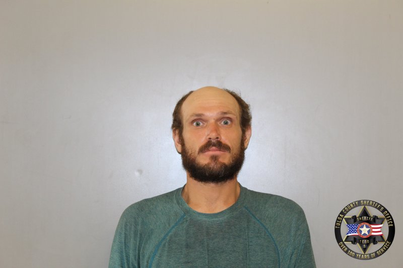 Booking photo of Derek Hixon
