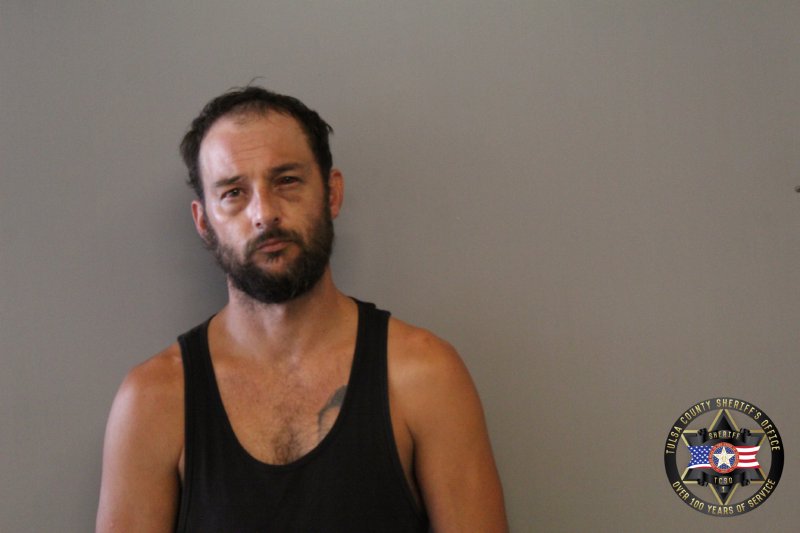 Booking photo of Dustin Miller