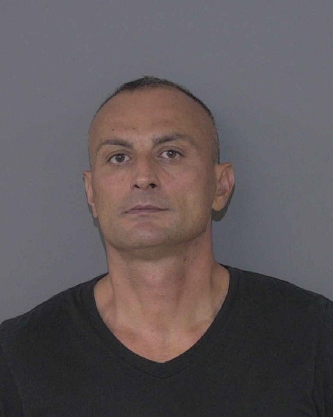 Booking photo of Mykola Tkachenko