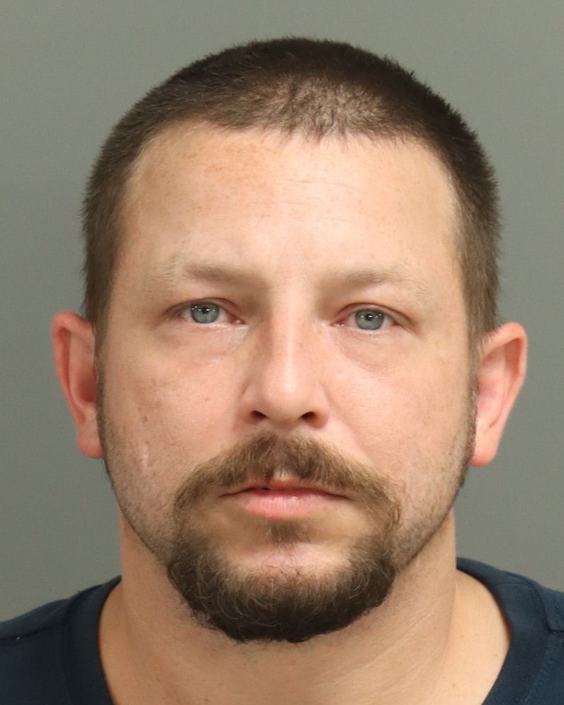 Booking photo of Michael Cox