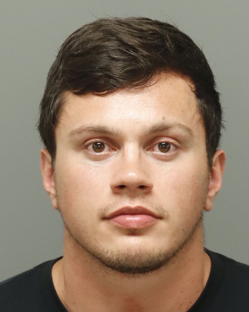Booking photo of Brandon Comninos