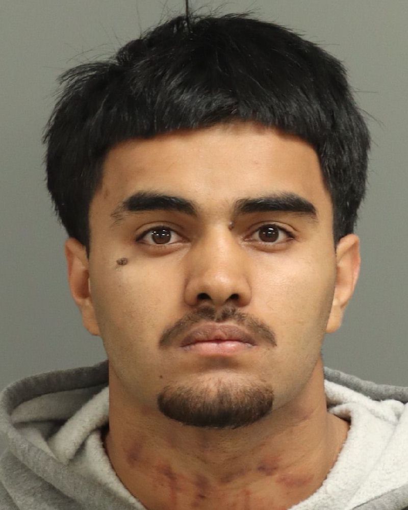 Booking photo of Ezatullah Kamawal