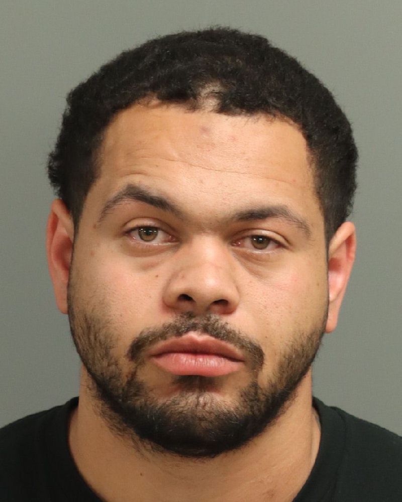 Booking photo of Malik Wellman