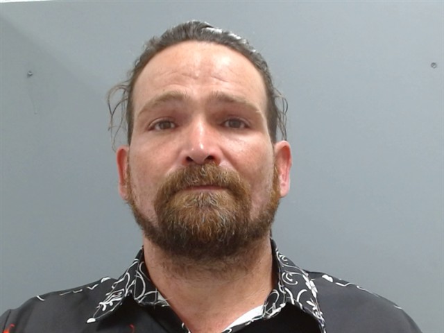 Booking photo of Mike Rutherford