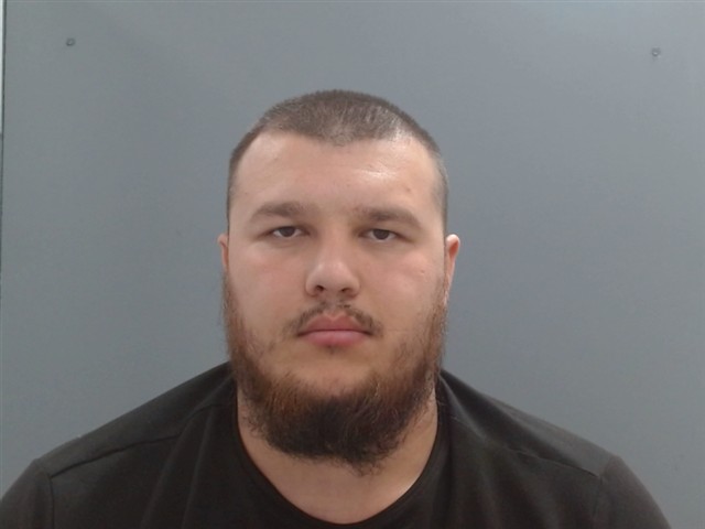 Booking photo of Ilyos Baymuratov