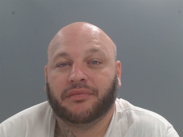 Booking photo of Dustin Frakes