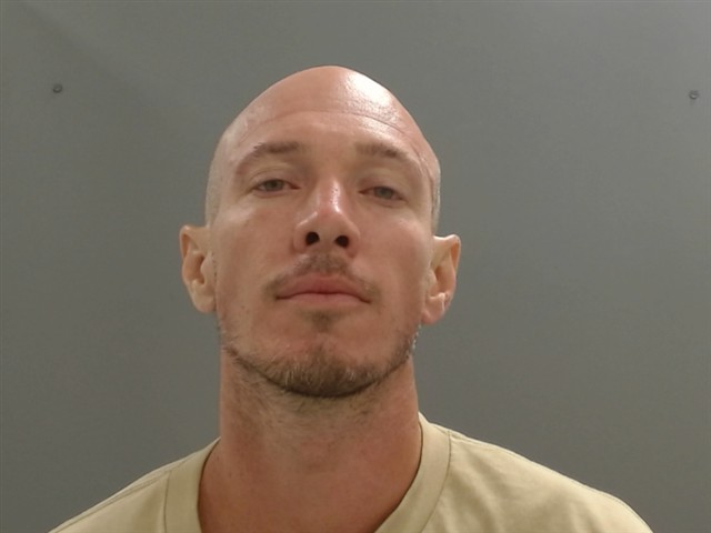 Booking photo of Andrew Baker