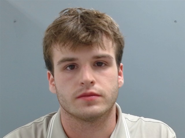 Booking photo of Christopher Cox
