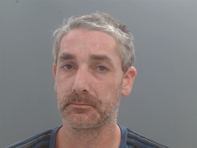 Booking photo of Mark Rahat