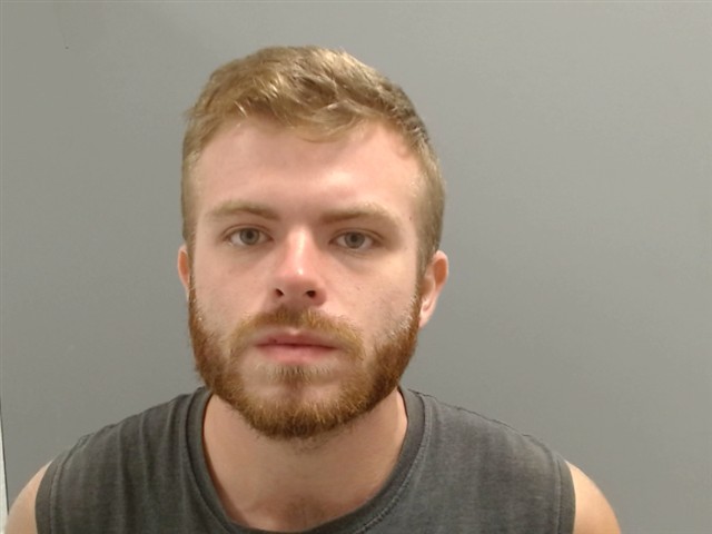Booking photo of Adam Compton