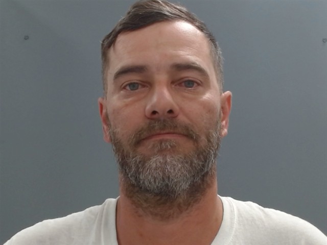Cy Wall booking photo